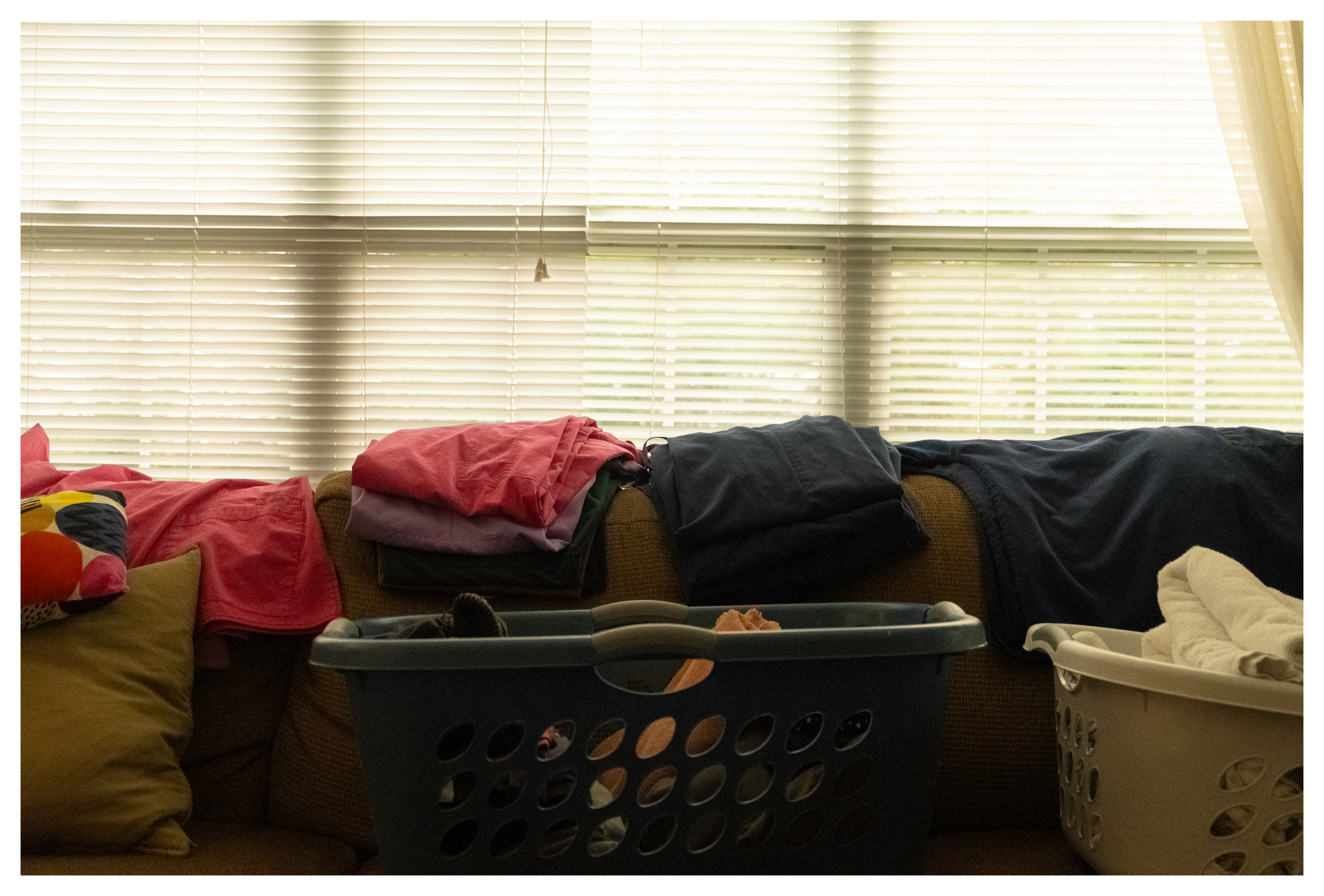 laundry strewn across a couch